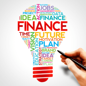 Many financial keywords such as "finance", "plan", "jobs" in the shape of a lightbulb. There is a hand with a pen drawing it.